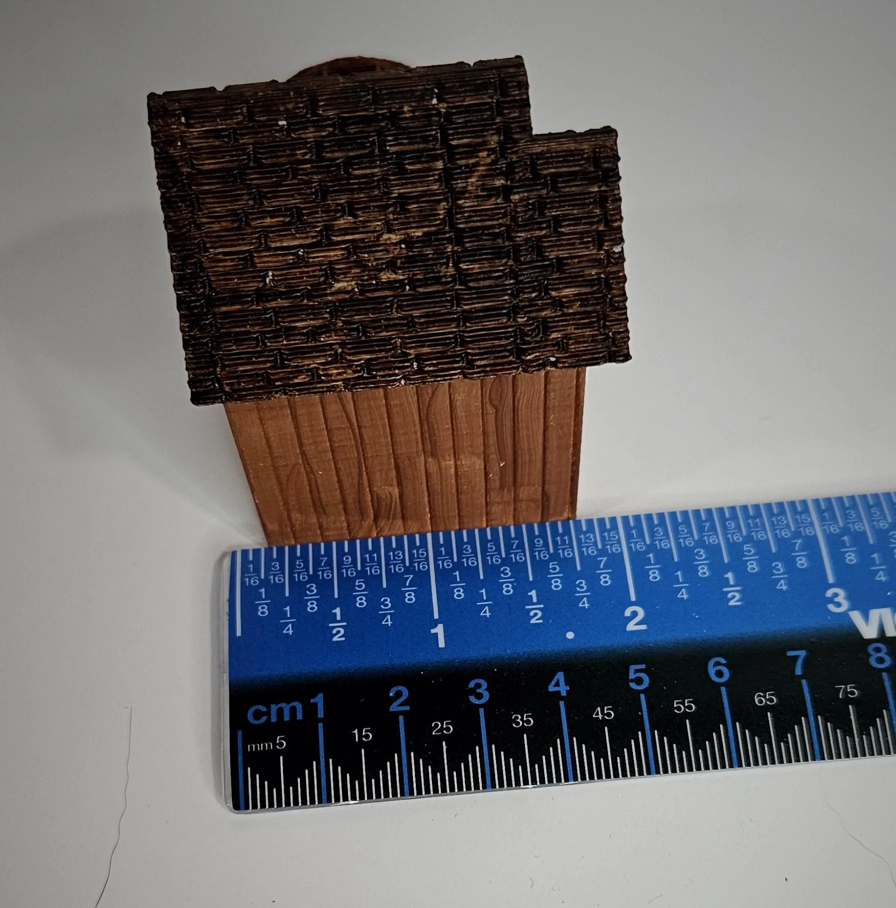 HO scale waterwheel with medium building on display